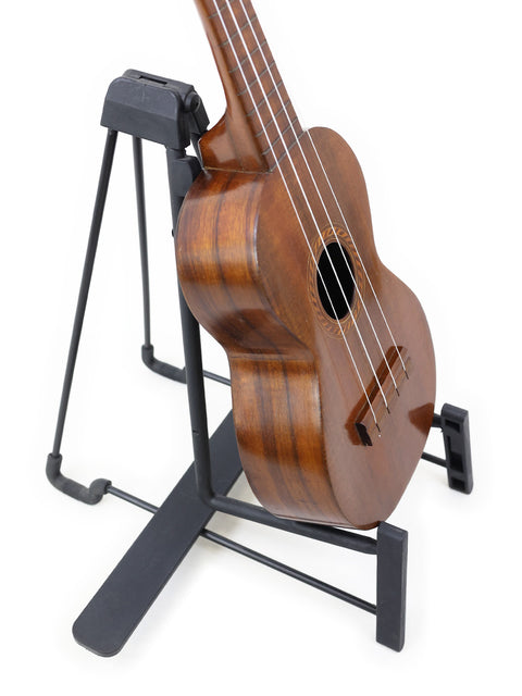 Another angle of the Aloha/Akai Style 2 Concert Ukulele on its stand, capturing the detailed construction and Hawaiian heritage of this 1930s instrument.