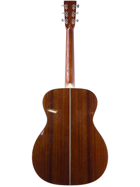 Back view of a Martin Custom Shop 000-28 acoustic guitar, showcasing its elegant wooden back from the USA, 2018 model.
