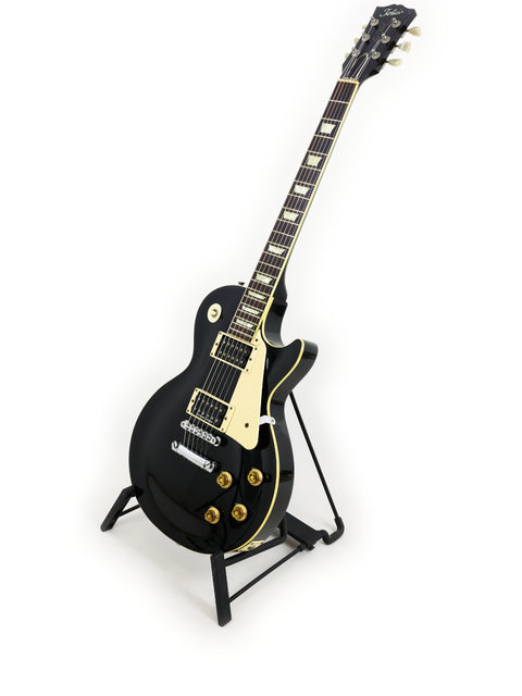 Black electric guitar on a stand, a Tokai Les Paul Reborn LS50 from Japan, made in 1979.
