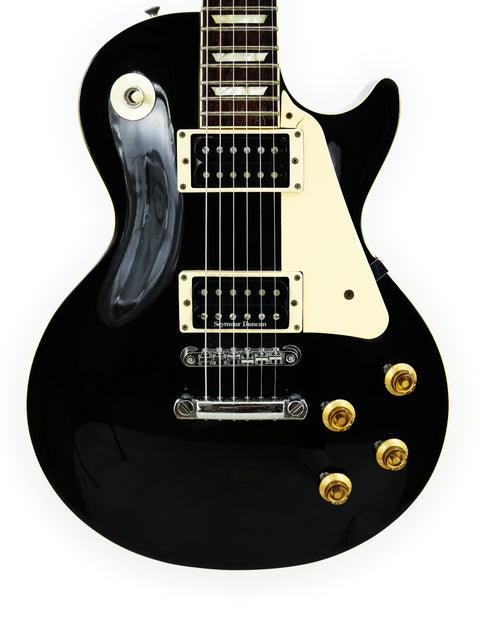 Black electric guitar with a white pickguard, Tokai Les Paul Reborn LS50, made in Japan, 1979.
