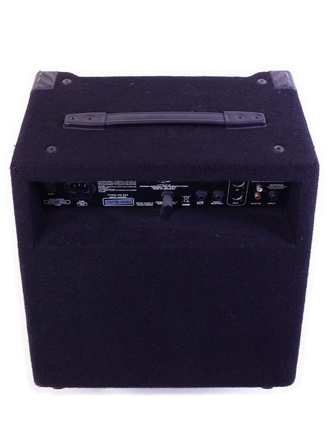 Black guitar amplifier with control panel and carrying handle on white background.