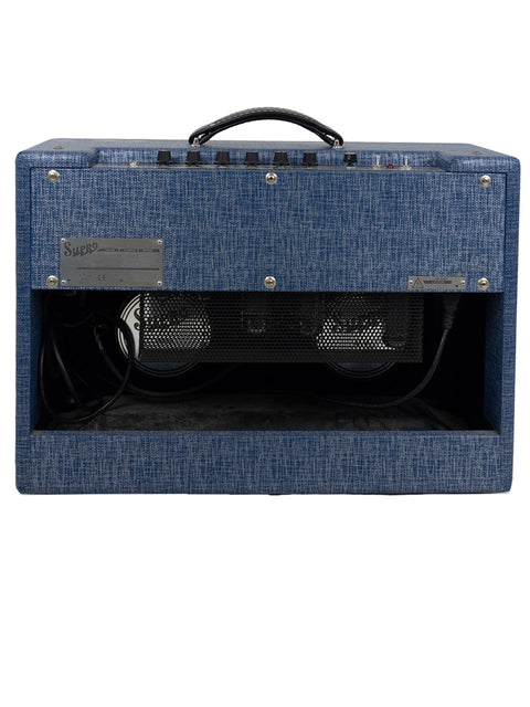 Blue guitar amplifier, Supro Royal Reverb 1650 RT Combo, set on a white background, emphasizing its stylish look.
