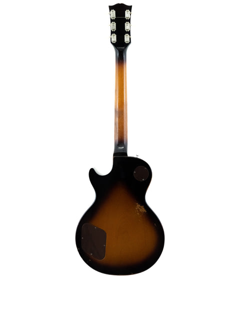 Classic 1973 Gibson Les Paul Standard showcasing a brown body complemented by a black pickguard.