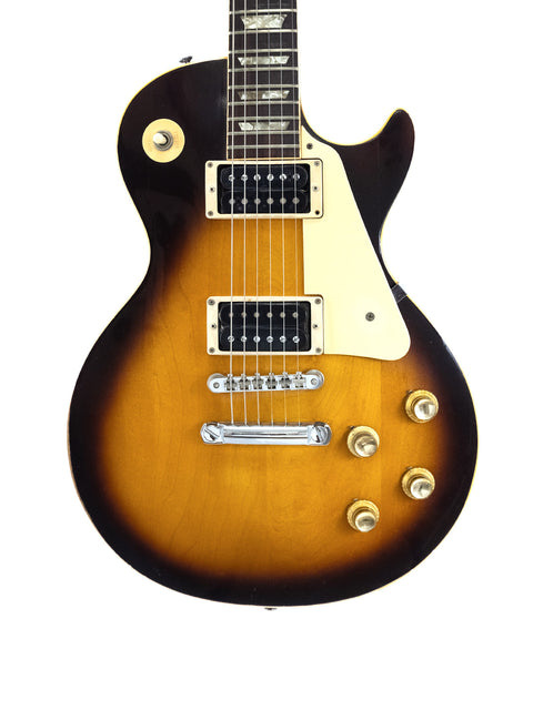 Classic sunburst Gibson Les Paul Standard from 1973, representing vintage American craftsmanship and timeless style.