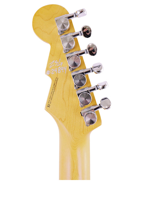 Close-up image of a Reverend Double Agent guitar head, featuring a striking yellow body, emphasizing its stylish and modern look.