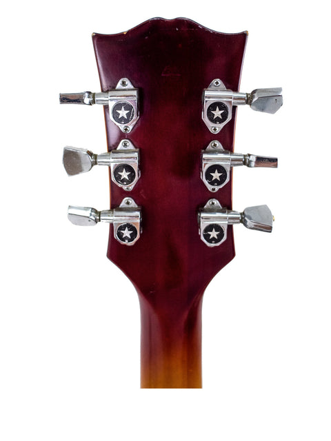 Close-up image of the headstock from a 1977-78 Ibanez 'Lawsuit' Les Paul Custom Copy, emphasizing its unique craftsmanship.