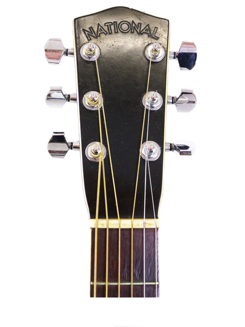 Close-up of a 1937 National Trojan Resonator acoustic guitar, highlighting its vintage features and resonator body.