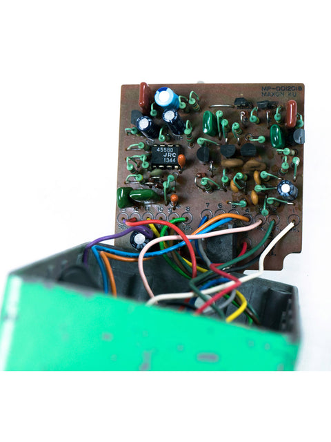 Close-up of a 1979 Ibanez TS-808 circuit board, featuring intricate wires and components in a vintage design.