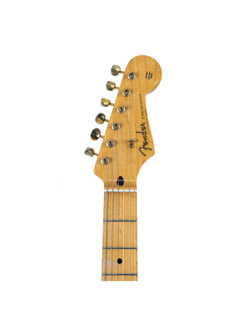 Close-up of a Fender MIJ '57 Style Stratocaster guitar, highlighting its neck and headstock, made in Japan in 1992.
