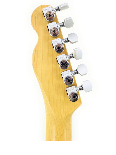 Close-up of a Fender Telecaster Plus Deluxe neck, showcasing its smooth finish and detailed fretboard from 1992.