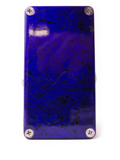 Close-up of a blue and black guitar pick with a silver plate, used with the Paul Cochrane ‘Timmy’ Overdrive Pedal.