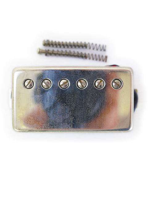 Close-up of a silver guitar pickup, screw, and screwdriver, featuring Peter Florance Voodoo Humbucker ’59 Pair, USA 2005.