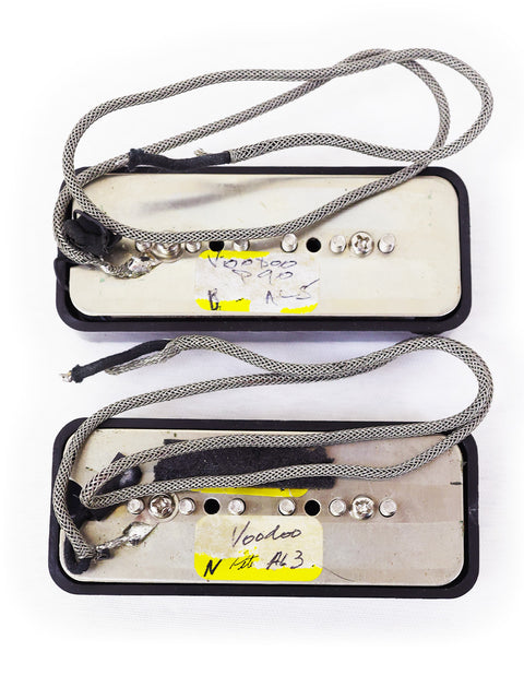 Close-up of two Peter Florance Voodoo P90 guitar pickups with wires, highlighting their unique features from USA 2000.