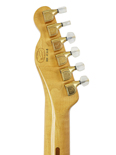 Close-up shot of the neck of a 1988 Fender 40th Anniversary Telecaster, emphasizing its unique craftsmanship and details.