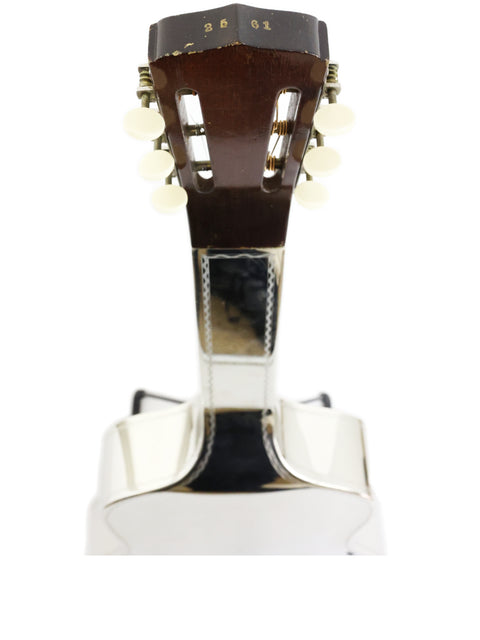 Detailed view of a 1932 National Tricone Style 1.5 Squareneck guitar on a white backdrop.