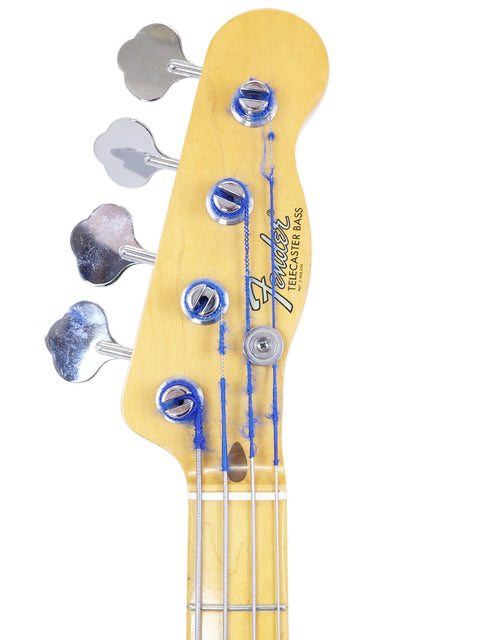 Detailed view of a 1968 Fender Telecaster Bass showcasing its unique blue and white design.