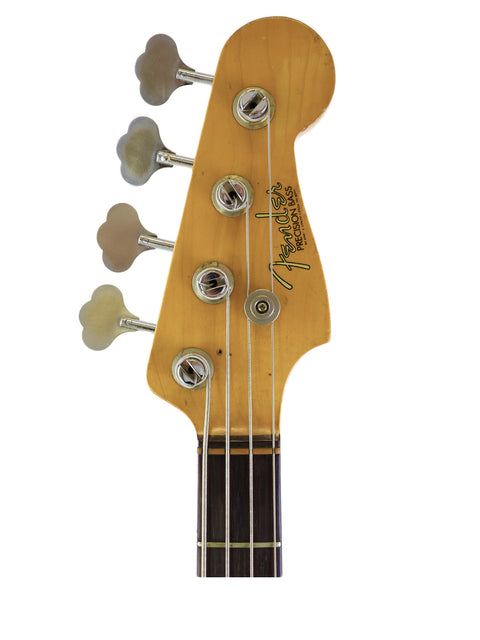 Detailed view of a 1972 Fender Precision Bass guitar on a white background, highlighting its vintage features and elegant finish.