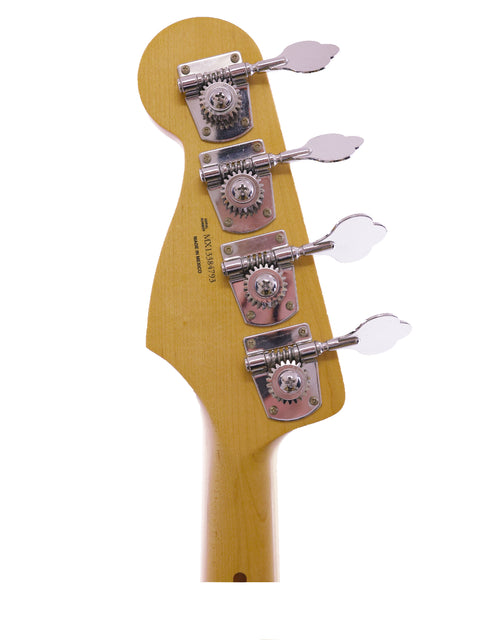 Detailed view of a 2013 Fender Jazz Bass neck with four knobs, highlighting the instrument's quality and features.