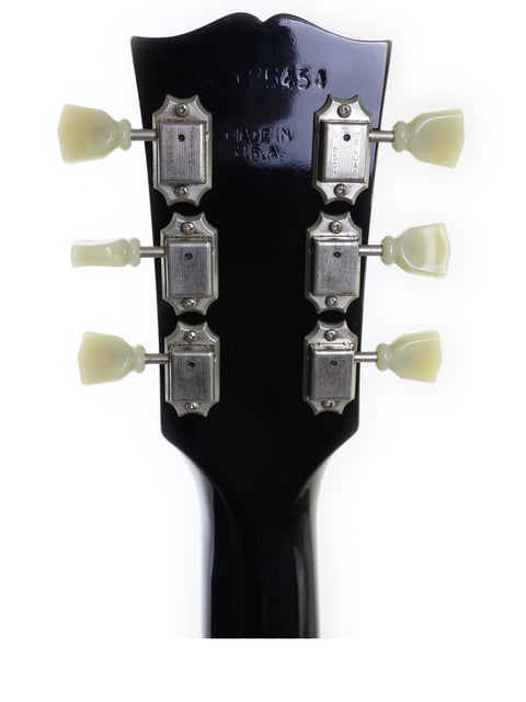 Detailed view of a Gibson Les Paul Standard headstock from 1995, highlighting the craftsmanship and tuning mechanisms.
