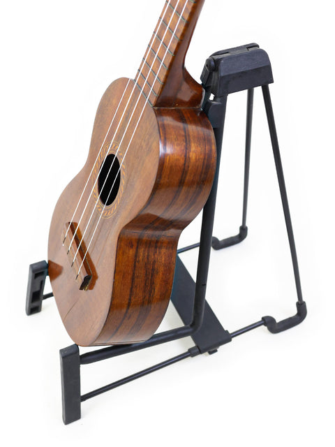 Detailed view of the body and side of the Aloha/Akai Style 2 Concert Ukulele, highlighting its fine wood craftsmanship and concert size.