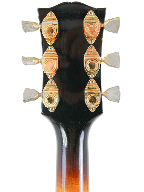 Detailed view of the headstock from a 1966 Vintage Gibson Byrdland electric guitar, highlighting its vintage charm.