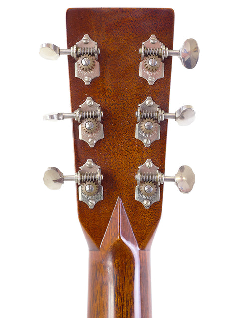 Detailed view of the headstock from a 2018 Martin Custom Shop 000-28 acoustic guitar, highlighting its premium materials and finish.