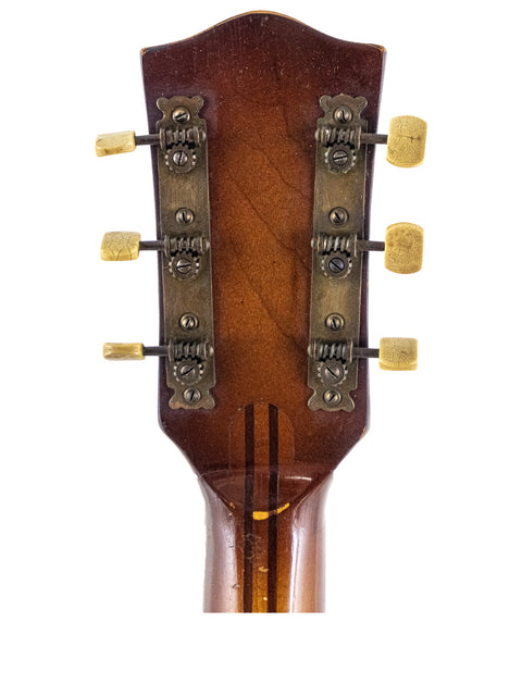 Detailed view of the headstock from a vintage Hofner 455 Archtop guitar, made in Germany during the 1950s.