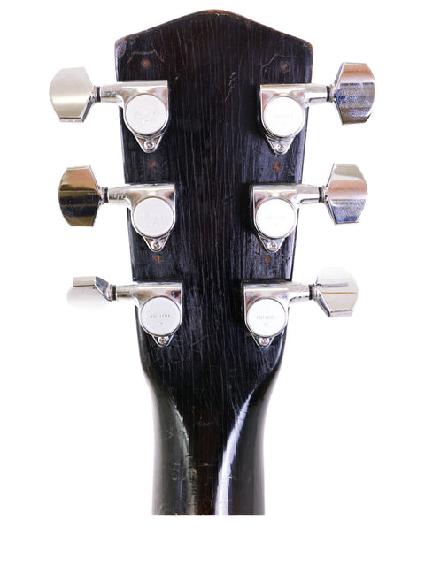Detailed view of the headstock of a 1937 Vintage National Trojan Resonator acoustic guitar, highlighting its vintage features.