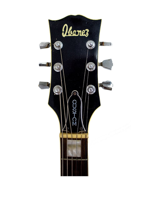 Detailed view of the headstock of a 1977-78 Ibanez 'Lawsuit' Les Paul Custom Copy, highlighting its classic features.
