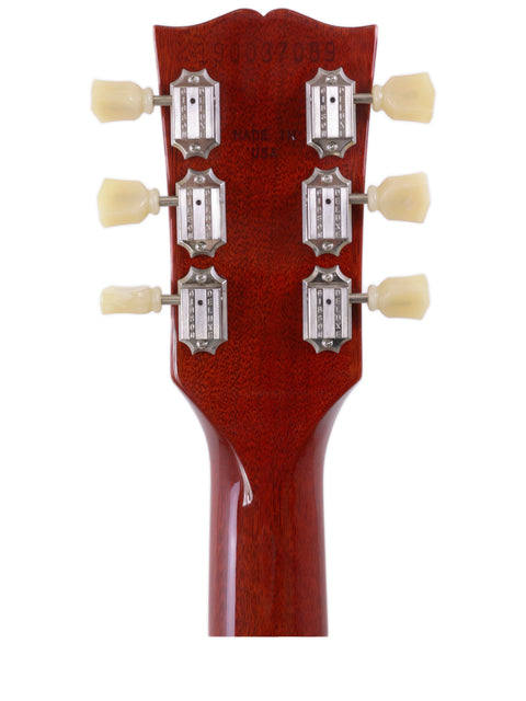 Detailed view of the headstock of a Gibson SG Standard '61 electric guitar, highlighting its craftsmanship and vintage appeal, USA 2019.