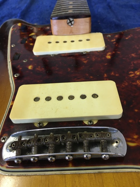 Detailed view of the neck pickup on a 1960 USA Fender Jazzmaster, highlighting its vintage features and classic appeal.
