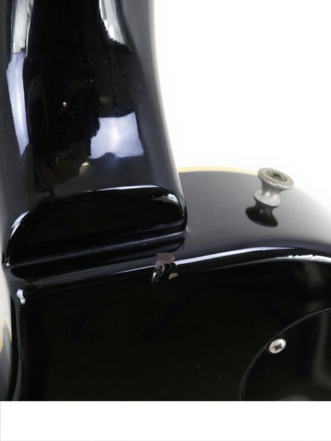 Detailed view of the top of a black 1979 Tokai Les Paul Reborn LS50 guitar, highlighting its craftsmanship and elegance.