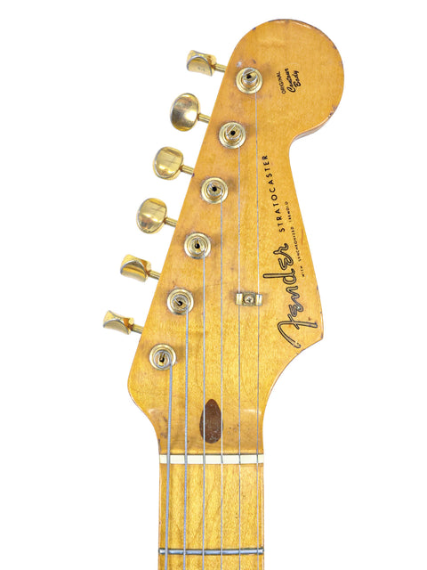 Displayed is a 1988 Homer Haynes Limited Edition ’57 Fender Stratocaster, known for its exceptional quality and style.