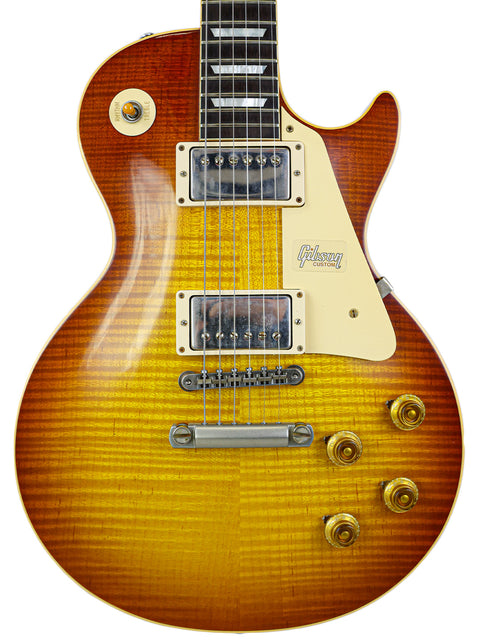 Elegant Gibson Les Paul Custom in sunburst, with a Brazilian rosewood fretboard, representing iconic guitar artistry from 2018.