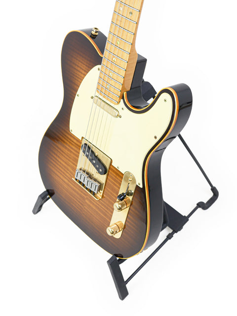 Fender 40th Anniversary Telecaster Limited Edition guitar featuring a sleek black body and a warm brown neck, USA 1988.