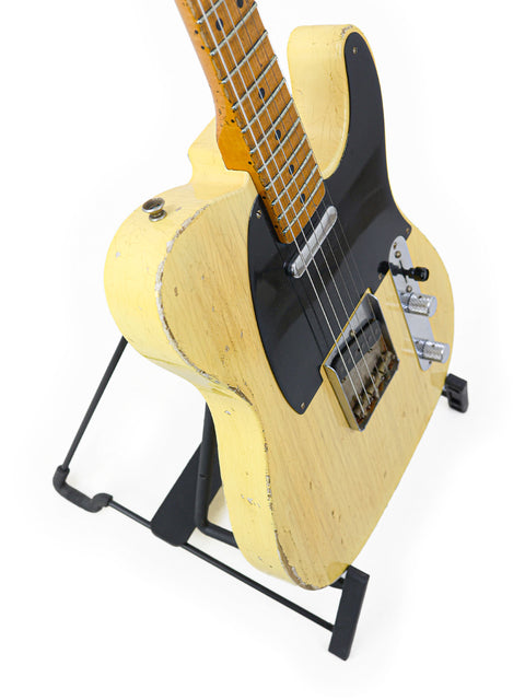 Fender Broadcaster guitar, crafted by Carlos Lopez for the 70th Anniversary, stands on a white background.