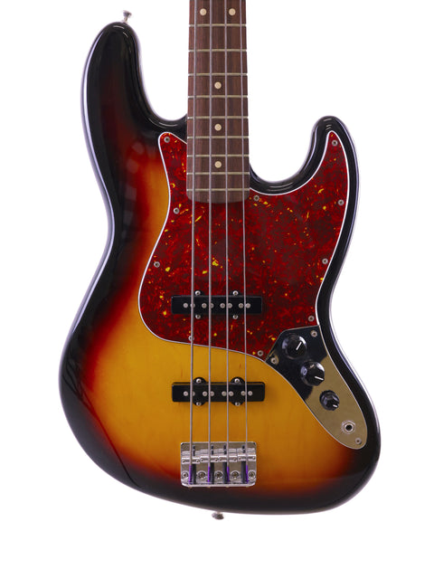 Fender Jazz Bass guitar with a sunburst finish, showcasing its vibrant colors and sleek design from Mexico, 2013.