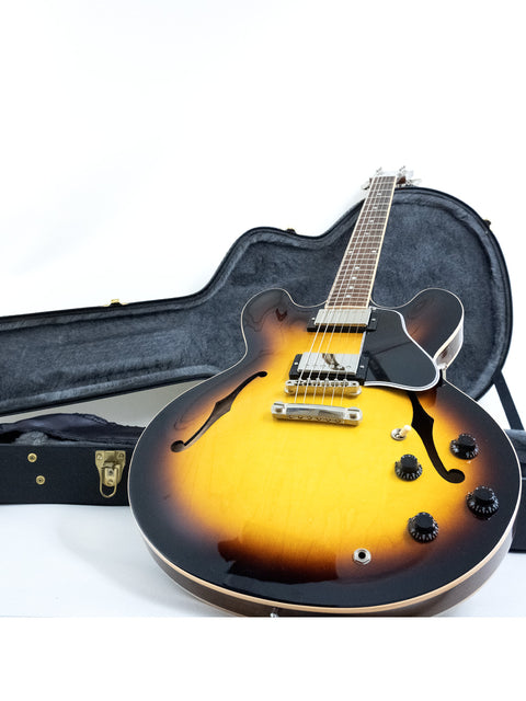 Gibson Custom ES-335 guitar with a sunburst finish and dot inlays, accompanied by its case, made in the USA in 2012.