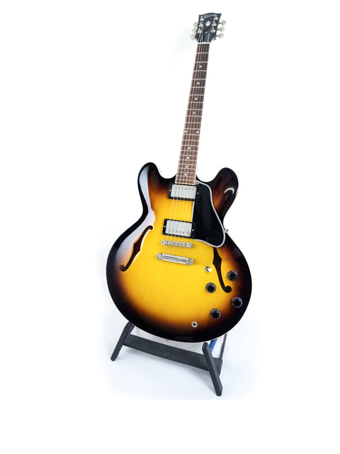 Gibson Custom ES-335 guitar with dot inlay displayed on a stand against a clean white background.