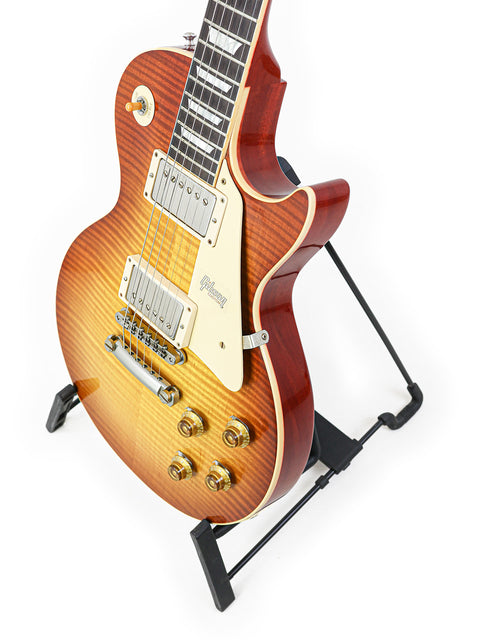 Gibson Custom Shop '59 Les Paul Standard R/I guitar with Brazilian Rosewood is elegantly positioned on a stand.