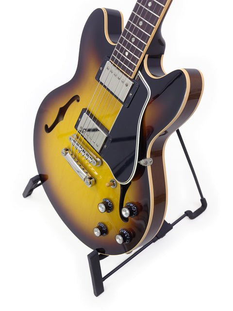 Gibson Custom Shop ES 339 Memphis guitar featuring a sleek black body and vibrant sunburst finish, crafted in 2009.