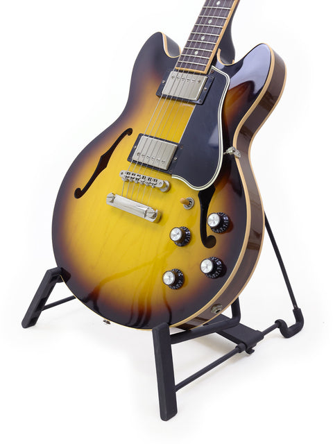 Gibson Custom Shop ES 339 Memphis guitar from 2009 resting on a stand, highlighted by a simple white background.