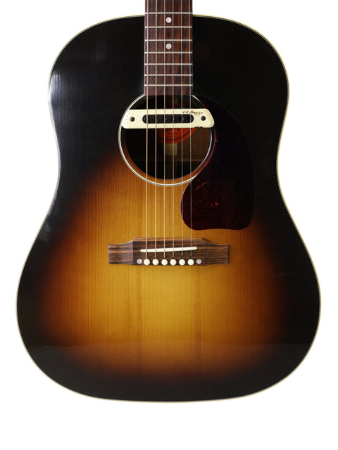 Gibson J-45 True Vintage guitar in black and brown with a stunning sunburst finish, highlighting its vintage appeal.
