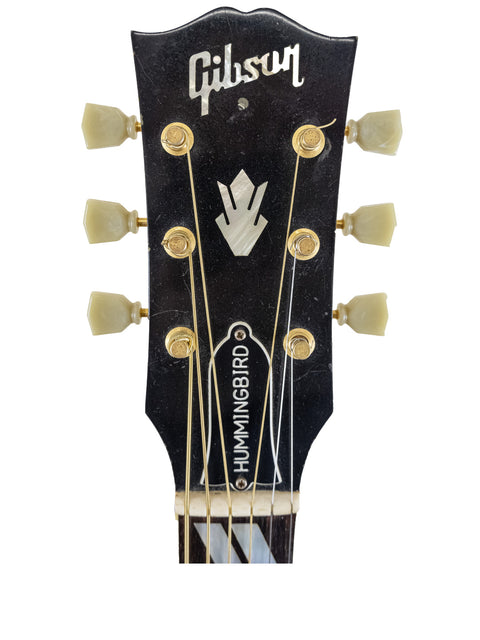 Gibson Les Paul Custom Shop '59 Vintage guitar, showcasing its classic design and craftsmanship, alongside a Hummingbird True Vintage.

