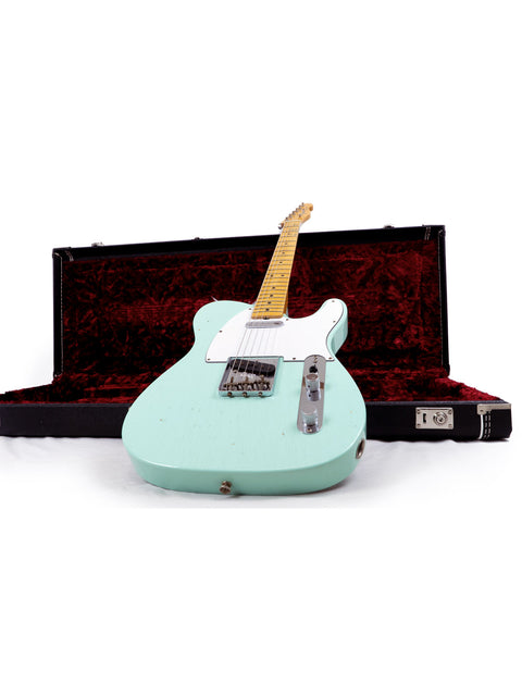 Green electric guitar in a case, showcasing the Fender Custom Shop 60s Journeyman Telecaster from the USA, 2018.