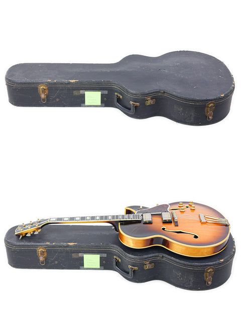 Inside a case, a vintage 1966 Gibson Byrdland guitar in sunburst stands out alongside another guitar, exuding classic charm.