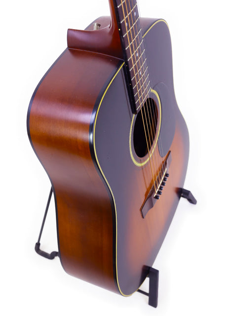 K. Yairi W1S acoustic guitar, brown finish, displayed on a stand, made in Japan in 1983.