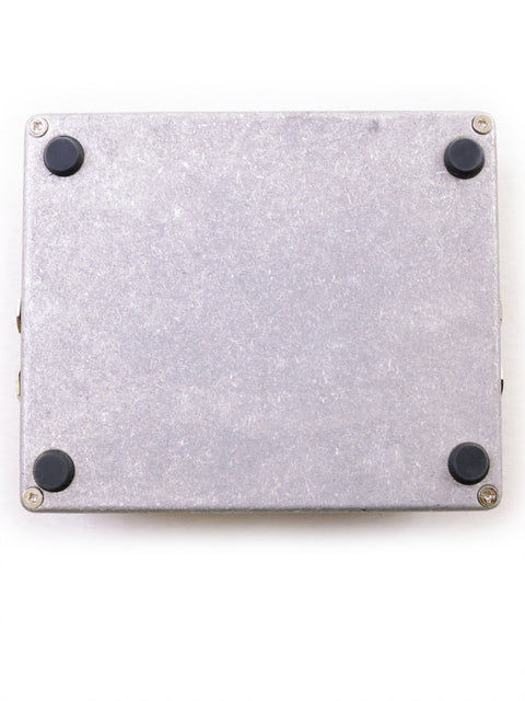 Metallic case with black rubber feet on a white background.