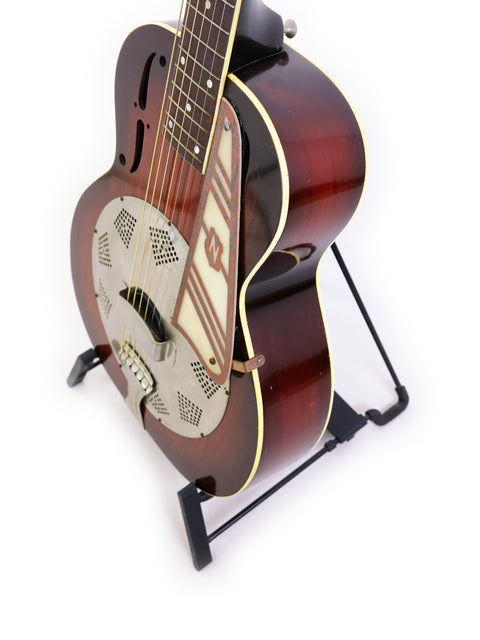 National Trojan Resonator guitar from 1937 on a stand, set against a plain white background.
