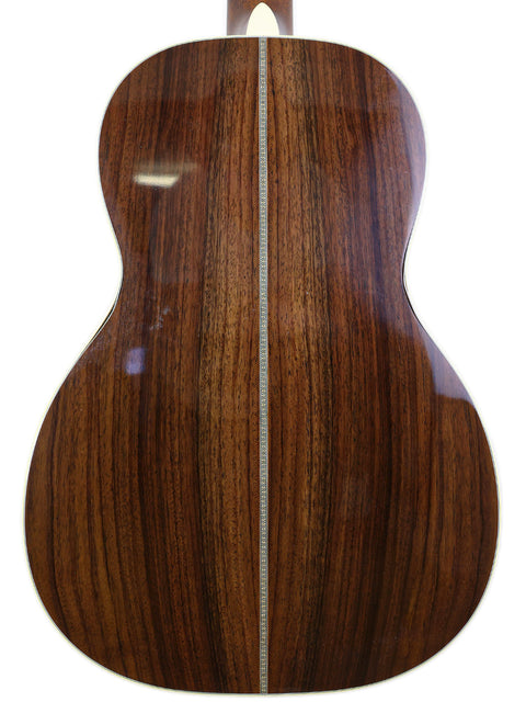 Rear view of a Martin 00-28VS acoustic guitar, featuring a beautifully crafted wooden back, made in the USA, 2014.